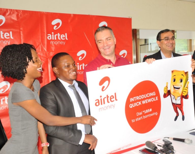 Airtel boss Anwar Soussa (in red tshirt), joined by Ronald Wakabi, the JUMO Country Director (2nd L) launch the service yesterday at Airtel