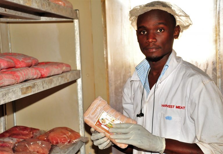 Tom Musinguzi displaying some of his products