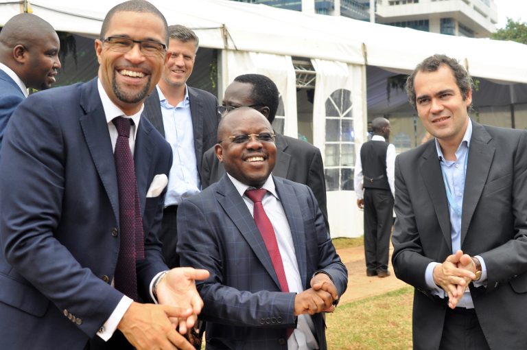 Daniel Petterson (L), the Hima Cement Country CEO, Waiswa Arnold, the Director of Environmental Monitoring and Compliance at NEMA and Floren