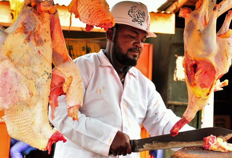 Kisekka slicing the slaughtered turkey