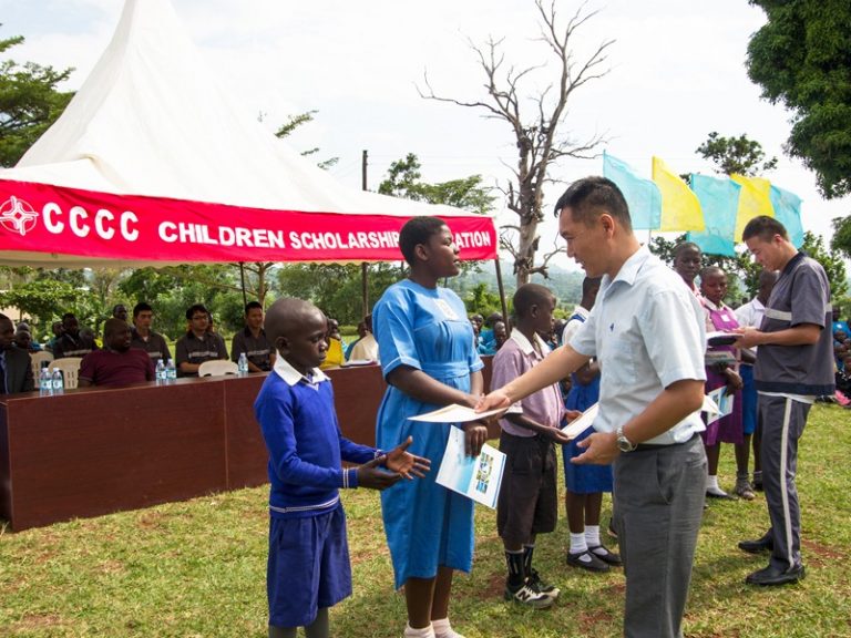 MKK project manager Ju Wenjie handing over certificates to beneficiaries