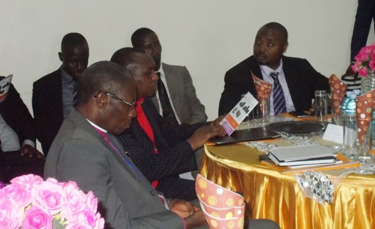 Namirembe Diocese Bishop Rt Rev Bishop Kityo Luwalira (L) seated next to Equity Bank's Rt Rev. Charles Kariuki and ED Anthony Kituuka at the dinner organised by the bank at Namirembe Guest House
