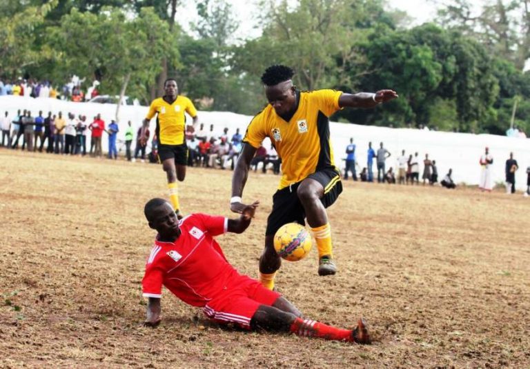 Kampala Province’s Yayo Lutimba attempts to dribble past a Bukedi opponent in the opening match
