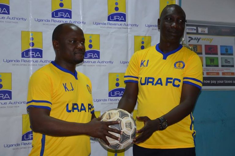 URA chairman James Kiiza unveils Kirya, right, before he was fired after nine months in charge