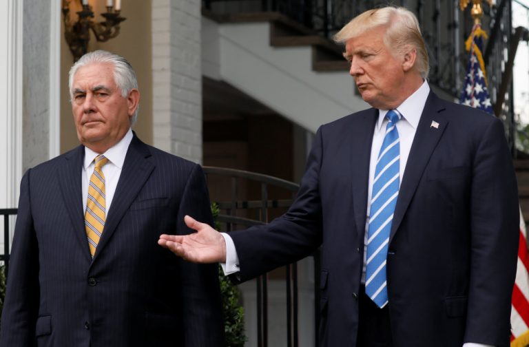 Trump defers to Tillerson to answer a reporter's question after their meeting at Trump's golf estate in Bedminster, New Jersey