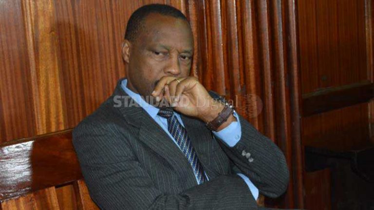 Moses Njue Gachoki being escorted to the cells at Milimani court. He was accused illegally harvesting the heart of Timothy Mwandi. [George Njunge, Sttandard]