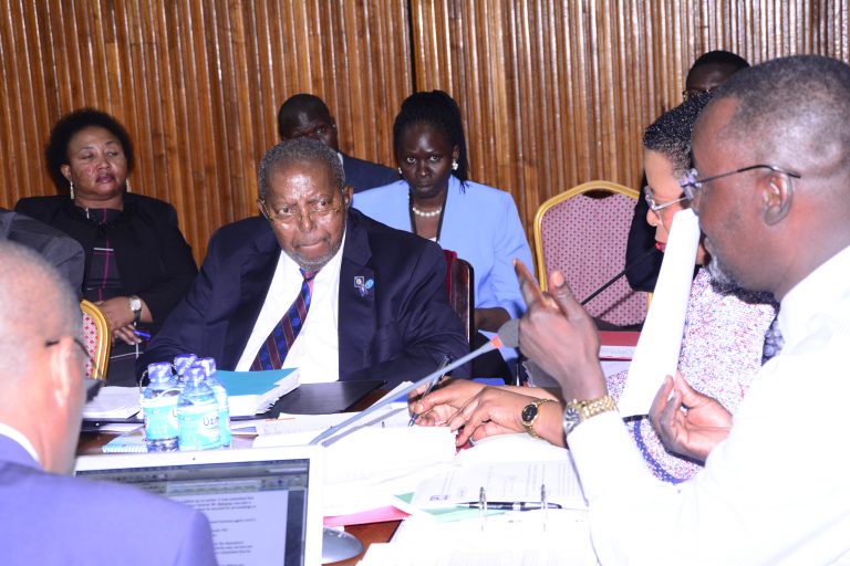 Mutebile (R) consulting Tumubweine Twinemanzi, the Executive Director -Supervision at BoU (2)