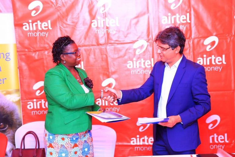 URA Commissioner General Doris Akol with Airtel CCO Amit Kapur at the ev...