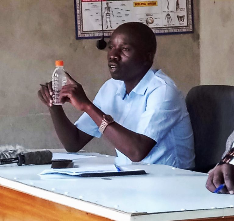 Sam displaying a herbal product