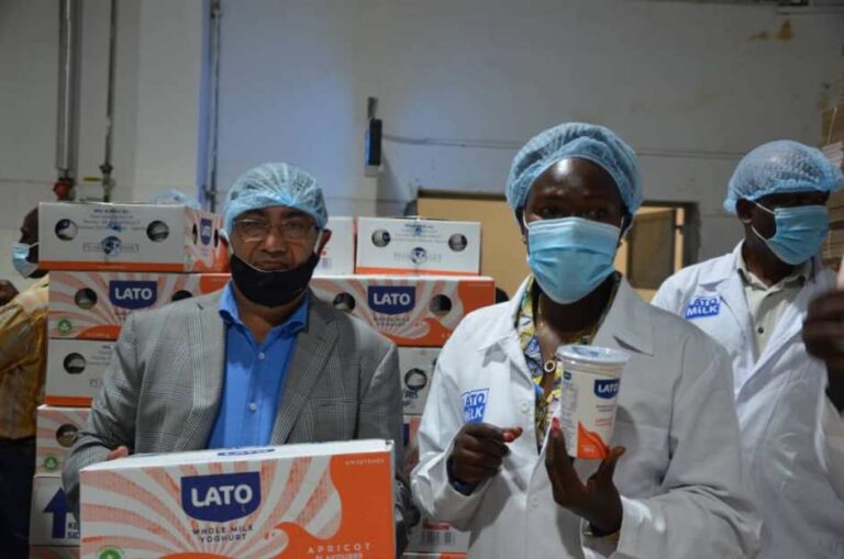 Investment Minister Hon. Evelyne Anite with the Pearl Dairy Chairman Mr. Bhasker Kotecha during the official launch of the Lato Yoghurt new flavours at factory in Mbarara(1)
