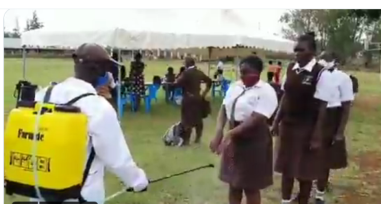Spraying students in Kenya