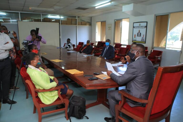 The Acting Permanent Secretary, James Ebitu (R) perusing the petition