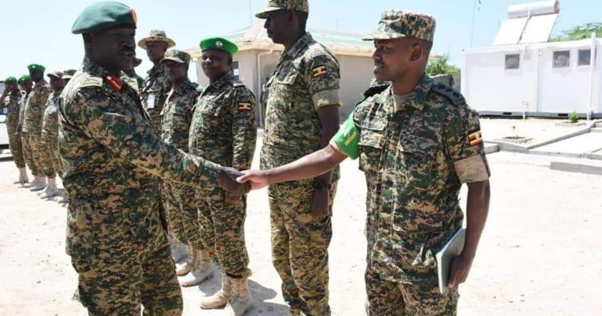 Gen Peter Elwelu greeting senior army officer at UPDF Contingent in Somalia