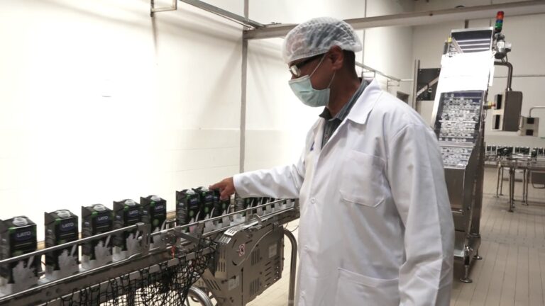 A Pearl Dairy official showcasig the new system