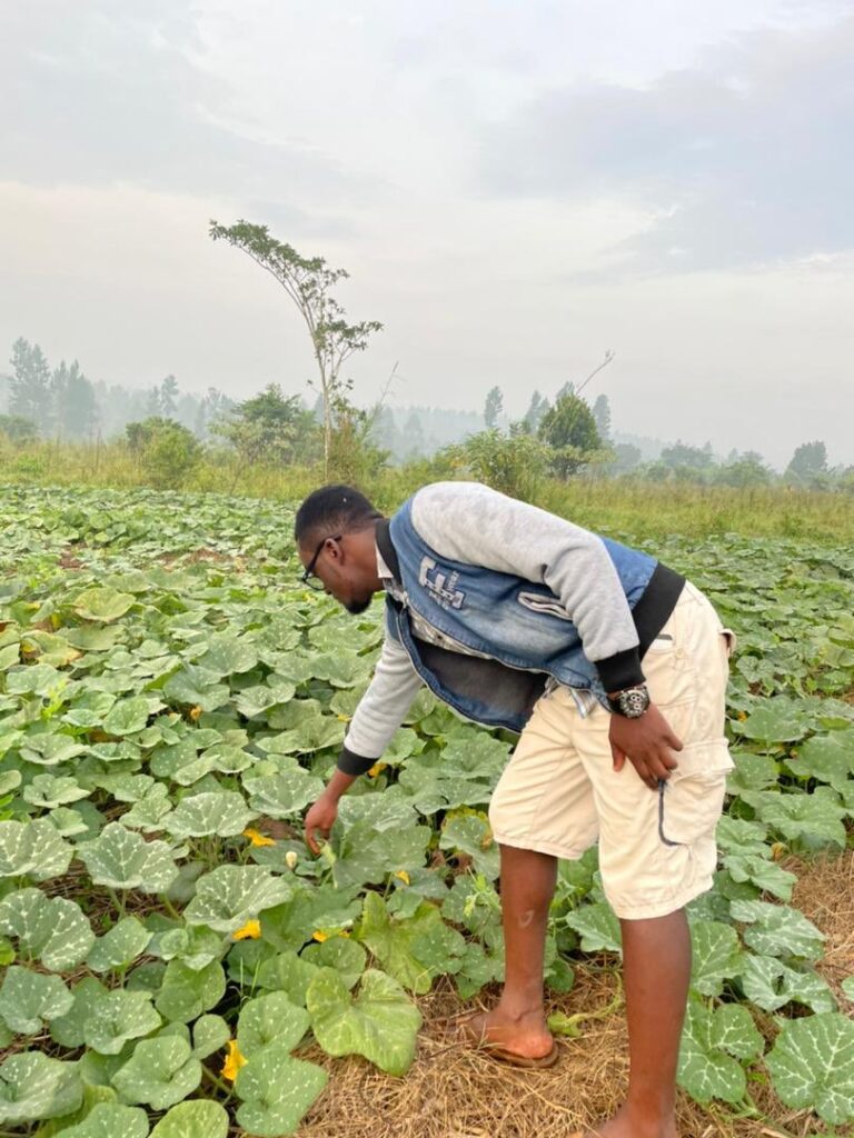 Mulwana on one of his visits to the farm in Kakiri