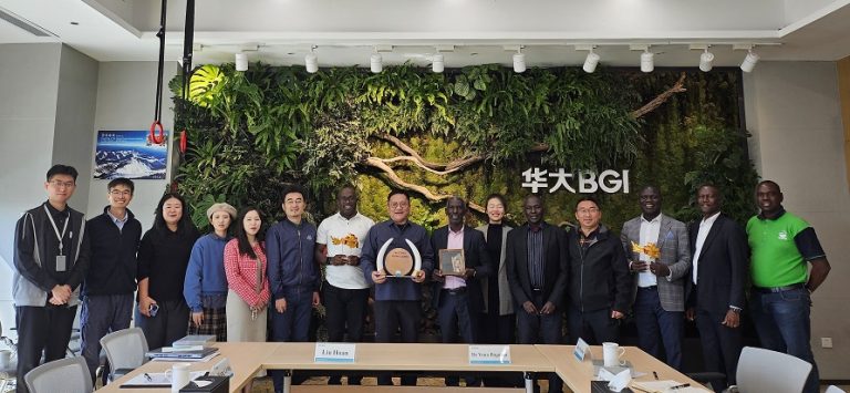 The NARO Director General, Dr. Yona Baguma and the CEO BGI Group, Yin Ye (both in center) after exchanging gifts during the meeting in China.