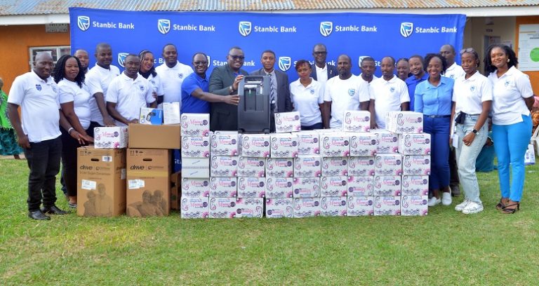 Stanbic Bank Staff Members led by Tunde Thorpe, Executive Head Business Commercial Banking Handover the vital equipement to Dr. Brian Kisembo Ast. DHO Kabarole District