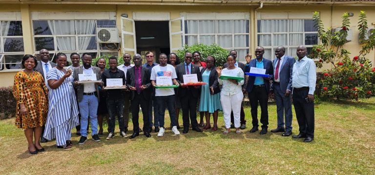 NARO Director General, Dr Yona Baguma (centre) with company representatives after the signing at Kajjansi on Monday