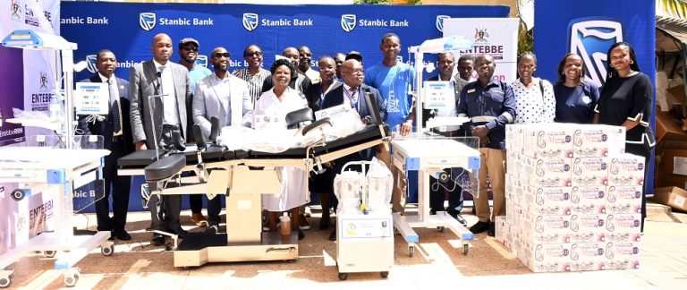 Staff from Stanbic Bank and Entebbe Regional Referral Hospital pose for a photo with the medical equipment that was donated.