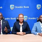 Israel Arinaitwe Head Personal Banking maing remarks, looking on is Yvone Namutosi, Head Digital Banking and E-Commerce and Arthur Kiwanuka Head Affluent Banking at Stanbic Bank Uganda