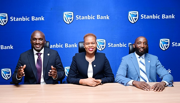 Israel Arinaitwe Head Personal Banking maing remarks, looking on is Yvone Namutosi, Head Digital Banking and E-Commerce and Arthur Kiwanuka Head Affluent Banking at Stanbic Bank Uganda