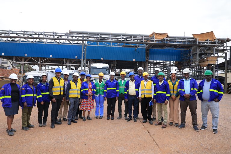 Vivo Energy executives and the team from Uganda Taxi Operators Federation pose for a group photo after the Depot Tour at Seventh Street Industrial Area.JPG