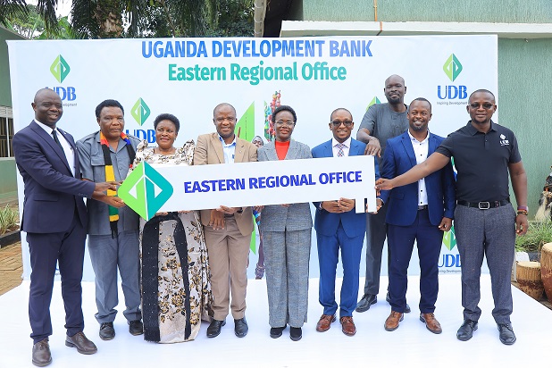 Mbale District Chairperson, Muhammad Mafabi and UDB Managing Director Dr. Patricia Ojangole are joined by MPs and the Bank's management team for a group photo during the launch