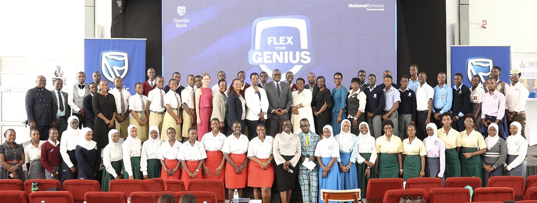 The Guest of honor Ms. Allen Kagina poses for a group photo with students and partners at the launch of the Stanbic Bank National Schools championships